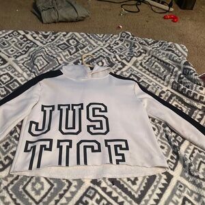 A white and black justice cropped hoodie